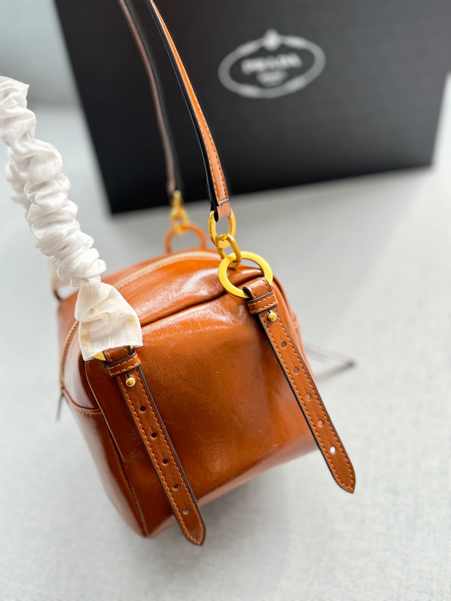 DANGLE TOP HANDLE MINI BAG 15 IN BROWN PATENT CALFSKIN