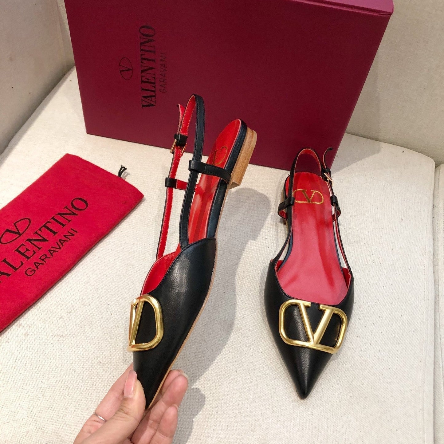 VLOGO SIGNATURE BLACK CALFSKIN FLAT SLINGBACK PUMP WITH GOLD LOGO