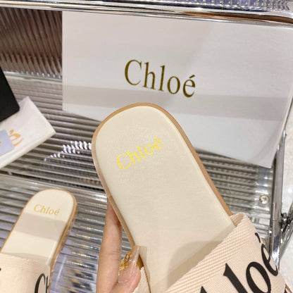 WOODY SLIPPER IN BEIGE MIX BLACK CANVAS