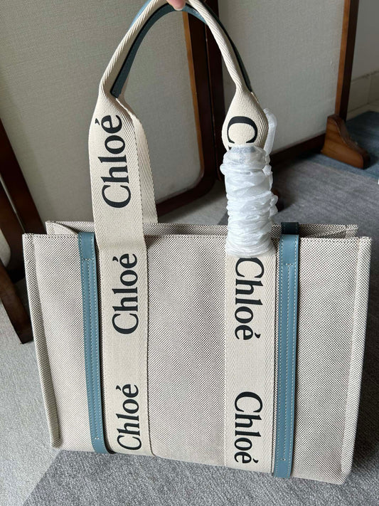 LAGRE WOODY TOTE BAG 45 IN BEIGE LINEN CANVAS BLACK WEBBING LOGO EMBROIDER BLUE CALFSKIN