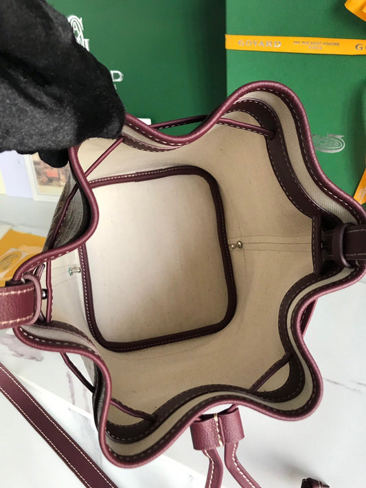 PETIT FLOT BUCKET BAG 22 IN WINE RED GOYARDINE CANVAS AND LAMBSKIN TRIM