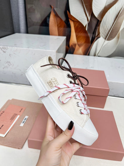 WASHED-DENIM SNEAKERS IN OFF WHITE CANVAS WITH BROWN AND STRIPED LACES