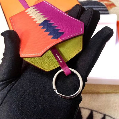 HERM Clochette Cles Grand Tressage Charm In Orange/Purple
