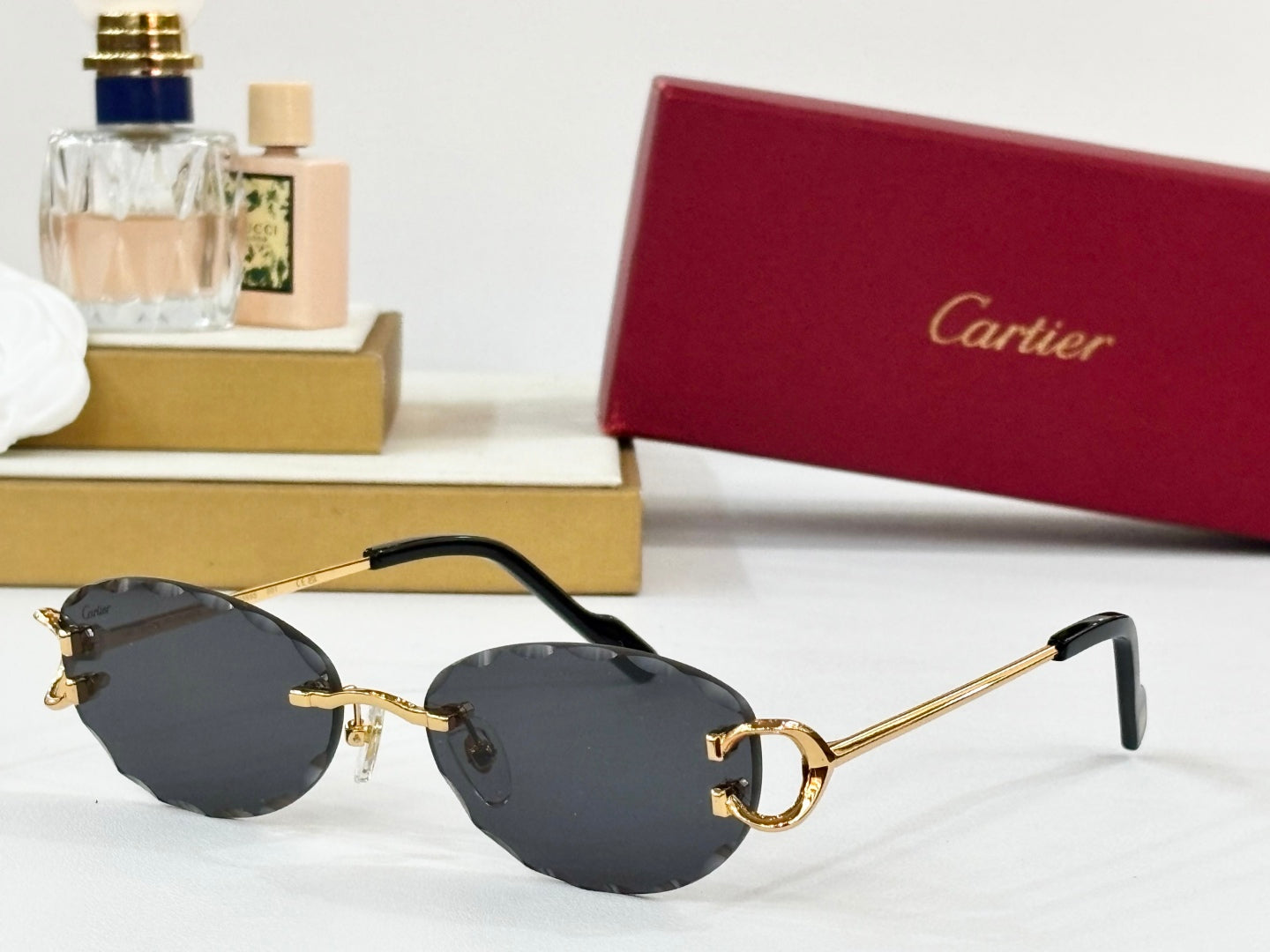 C DE RIMLESS ROUND FRAME SUNGLASSES CT0599S IN METAL
