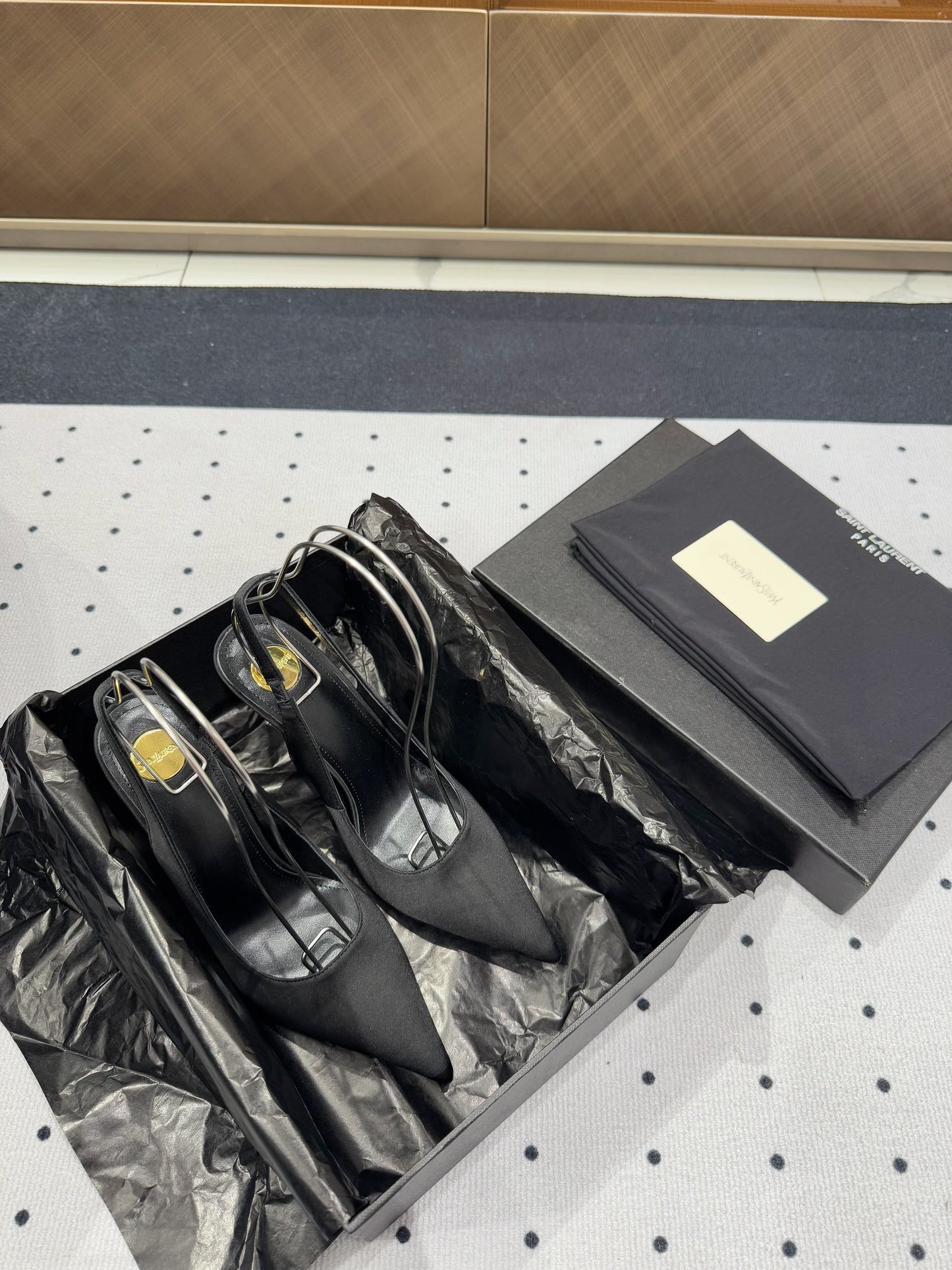 L'ENTRACTE SLINGBACK PUMPS IN BLACK SATIN