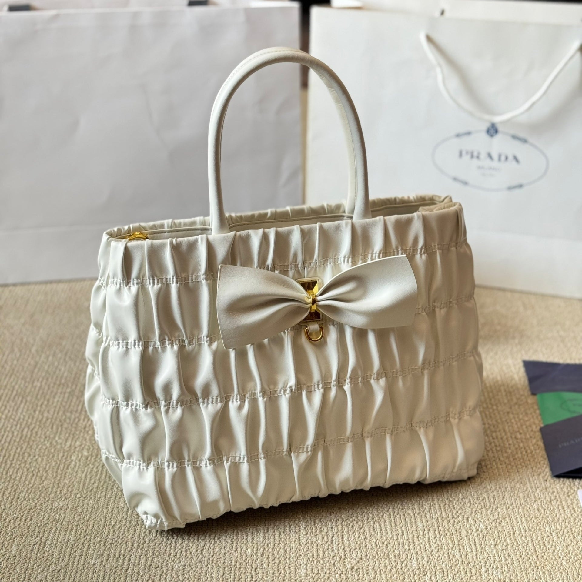 BOW DETAIL RUCHED TOP HANDLE BAG 28 IN WHITE SAFFIANO LEATHER