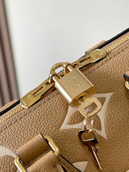 SPEEDY BANDOULIÈRE 20 IN MILK TEA MONOGRAM EMPREINTE LEATHER