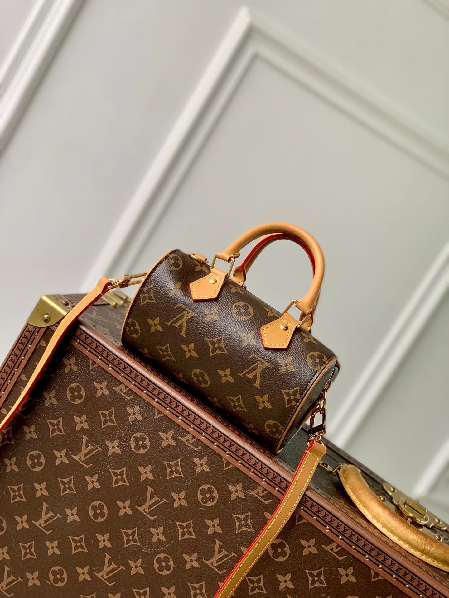 NANO SPEEDY DATING 18 IN BROWN COATED CANVAS GOLD HARDWARE