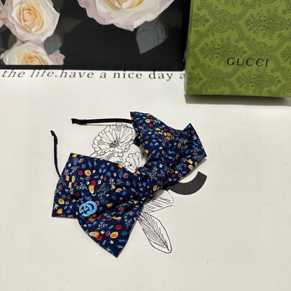 HAIRBAND IN NAVY BLUE FLORAL FABRIC 385854
