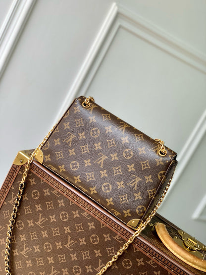 TRUNKIE 27 IN BROWN COATED CANVAS BLACK CALFSKIN SIGNATURE S-LOCK