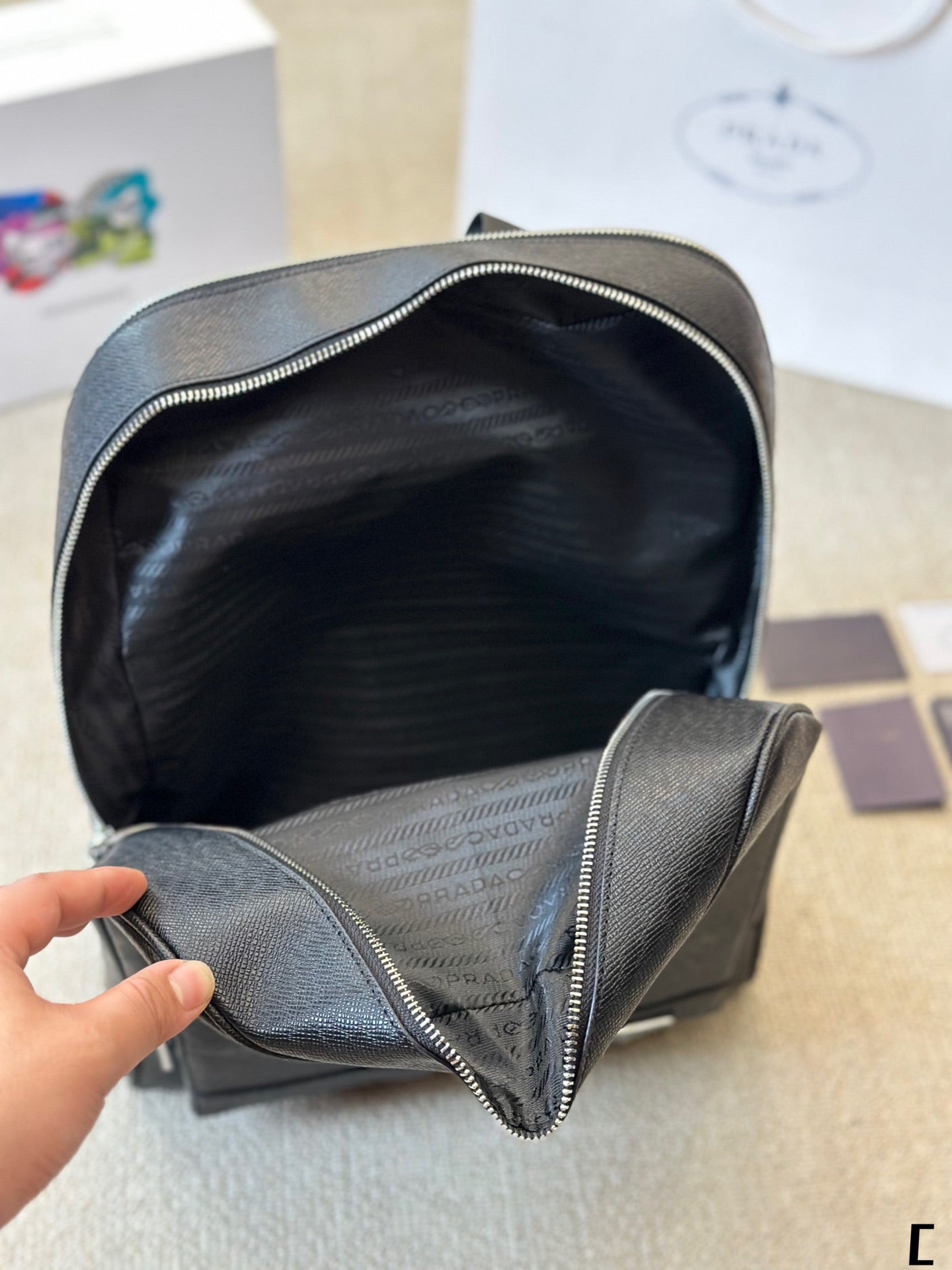 FRONT ZIP POCKET BACKPACK 38 IN BLACK GRAINED CALFSKIN