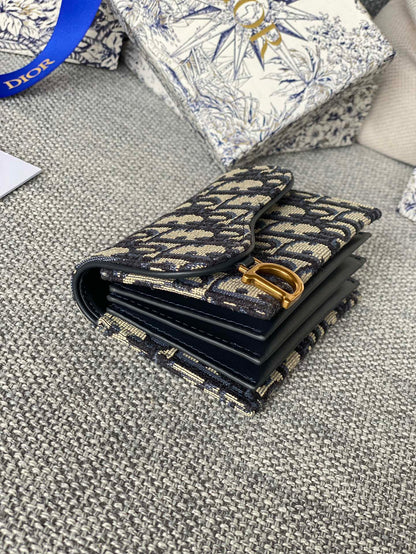 SADDLE LOTUS WALLET 11 IN BLACK MONOGRAM OBLIQUE JACQUARD